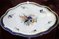 Caughley Porcelain eight-lobed dessert plate painted with Dresden Flower pattern at Coalport China Museum. Ironbridge, England.