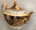 Teapot decorated in 'Japanese' or 'Imari' design with acorn shape gilded finial prob. John Rose of Coalport at Coalport China Museum. Ironbridge, England.