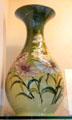 Flared neck vase painted with flowers by Salopian at Coalport China Museum. Ironbridge, England.