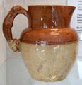 Earthenware jug with handle in form of dog prob. Benthall Pottery at Coalport China Museum. Ironbridge, England.