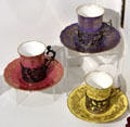 Yellow, pink & violet cups & saucers in silver holders by crown Coalport at Coalport China Museum. Ironbridge, England.