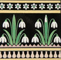 Transfer-printed tile with snowdrops by A.W.N. Pugin made by Minton & Co at Jackfield Tile Museum. Ironbridge, England.