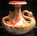 Swan art pottery vase painted lustre red by Walter Crane for Maw & Co at Jackfield Tile Museum. Ironbridge, England.