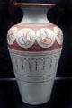 Salopian vase incised with butterflies on light gray & redbackground by Benthall Pottery at Jackfield Tile Museum. Ironbridge, England.