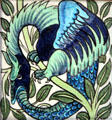Uroboros winged snake swallowing its tale hand-painted tile by William De Morgan at Jackfield Tile Museum. Ironbridge, England.