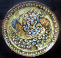 Peacock ceramic plate by William De Morgan at Jackfield Tile Museum. Ironbridge, England.
