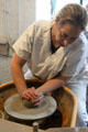 Forming wares on pottery wheel at Gladstone Pottery Museum. Longton, Stoke, England.