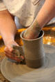 Forming wares on pottery wheel at Gladstone Pottery Museum. Longton, Stoke, England.