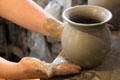 Forming wares on pottery wheel at Gladstone Pottery Museum. Longton, Stoke, England.