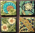 Four floral tiles by William De Morgan, Sands End at Gladstone Pottery Museum. Longton, Stoke, England.