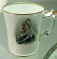 Example of over-glaze lithography on bone china mug commemorating Queen Victoria's Diamond Jubilee by Doulton & Co. of Burslem, Staffordshire at Potteries Museum & Art Gallery. Hanley, Stoke-on-Trent, England.