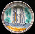 Tin-glazed earthenware charger painted with portrait of King William III & Queen Mary made in England or Holland at Potteries Museum & Art Gallery. Hanley, Stoke-on-Trent, England.