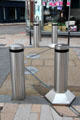 Traffic bollards which slide into place along tracks. Hanley, Stoke-on-Trent, England.