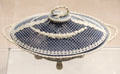 Wedgwood blue jasper woven covered basket with white ornaments at World of Wedgwood. Barlaston, Stoke, England.