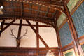 Elk head in Great Parlor at Wightwick Manor beside printed Orpheus lyre extract from St Cecilia's Day poem by Joseph Addison in Great Parlor at Wightwick Manor. Wolverhampton, England.