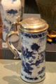 Porcelain tankard from China with underglaze blue topped with European silver mounts at Ashmolean Museum. Oxford, England.