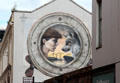 Mural of worker & wolf with shipyard beyond. Belfast, Northern Ireland.