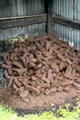 Pile of peat fuel at Ulster Folk Park. Belfast, Northern Ireland.