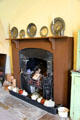 Basement fireplace with ceramic hot water bottles at Florence Court. Enniskillen, Northern Ireland.
