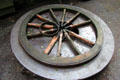 Wagon wheel held together by iron rim at forge at Ulster American Folk Park. Omagh, Northern Ireland.