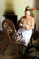 Spinning demonstration in weavers cottage at Ulster American Folk Park. Omagh, Northern Ireland.