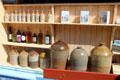 Stoneware & glass bottles in W G O'Doherty Licensed Grocery shop at Ulster American Folk Park. Omagh, Northern Ireland.