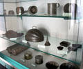 Antique tinware objects in E. Pattison Tinsmith shop at Ulster American Folk Park. Omagh, Northern Ireland.