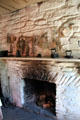 Fireplace in Pennsylvania Log Farmhouse at Ulster American Folk Park. Omagh, Northern Ireland.