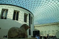 Glass atrium of Queen Elizabeth Great Court of British Museum over Reading Room & Stone Lion. London, United Kingdom