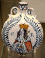 Earthenware tin-glazed wine flask with painted bust of King Charles II at British Museum. London, United Kingdom