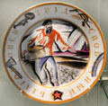 Russian porcelain plate with worker sowing seeds by V. Belkin for SPF at British Museum. London, United Kingdom.