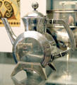 Silver tea pot with drum-shaped body by Christopher Dresser made by Elkington & Co. of Birmingham at British Museum. London, United Kingdom