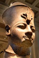 Red granite colossal head of a king from Thebes at British Museum. London, United Kingdom.