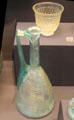 Roman era glass flagon plus cut-glass beaker found in Cambridgeshire at British Museum. London, United Kingdom.