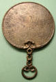 Celtic culture bronze mirror with engraved back found at Holcombe, Devon at British Museum. London, United Kingdom.