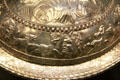 Roman flanged silver bowl showing Bacchus in profile between satyr being attacked by spotted cats part of Mildenhall Treasure at British Museum. London, United Kingdom.