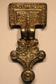 Anglo-Saxon gilt silver square-head brooch with scalloped border from Isle of Wight at British Museum. London, United Kingdom.