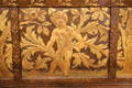 Detail of gilded plasterwork putti on oak settle by Philip Webb for Morris & Co at Morris Gallery. London, United Kingdom.