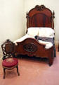 Carved wooden 3/4 bedstead by Prudent Mallard at Bragg-Mitchell Mansion. Mobile, AL.