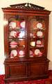 Cabinet with English Davenport China service at Conde-Charlotte Museum. Mobile, AL.