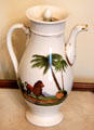 White porcelain coffee pot painted with lion & palm tree at Conde-Charlotte Museum. Mobile, AL.