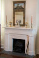 Fireplace with mantle clock, urns & mirror at Conde-Charlotte Museum. Mobile, AL.