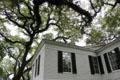 House wing under oak trees at Historic Oakleigh Museum House. Mobile, AL.