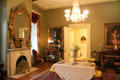 Back parlor with marble fireplace & piano at Historic Oakleigh Museum House. Mobile, AL.