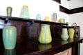 Collection of Arts & Crafts pottery vases by Grueby Faience, Burley-Winter Pottery, McCoy Pottery, Rookwood, etc. in Corbett House at Tucson Museum of Art. Tucson, AZ.
