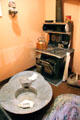 Bathtub beside cast iron wood burning cooking range at Arizona History Museum. Tucson, AZ.