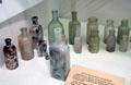 Collection of antique glass medicine bottles at Fort Lowell Museum. Tucson, AZ.