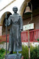 Statue of Father Junipero Serra & El Camino Real marker bell at Santa Barbara Mission. Santa Barbara, CA.