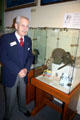 Docent at Maritime Museum with Marine Corp gear he had used in World War II. Monterey, CA.