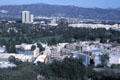 Overview of Universal Studios film lot plus Burbank in distance including tallest The Tower & brown Central Park Building. Universal City, CA.